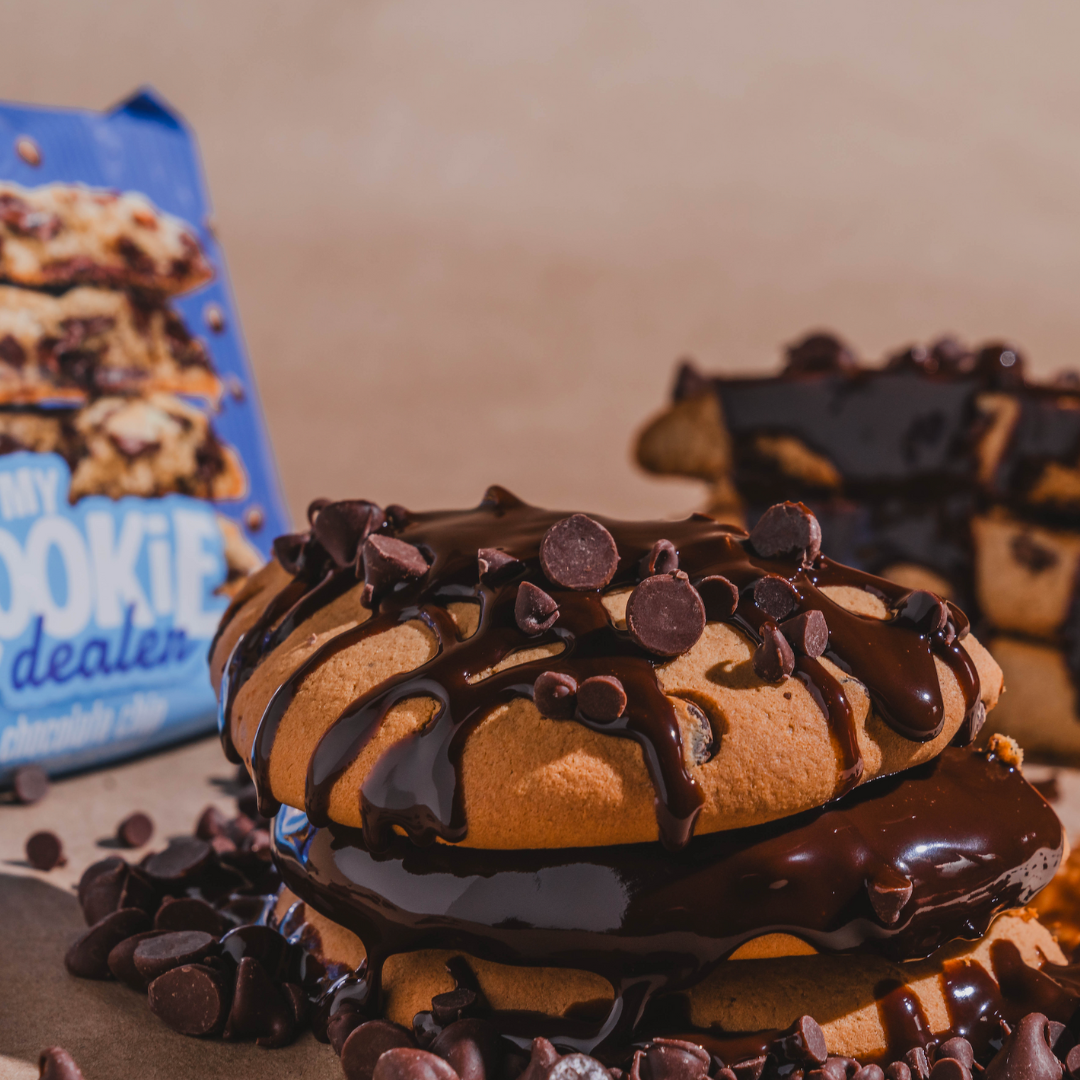 Close-up of chocolate chip protein cookies with chocolate drizzle