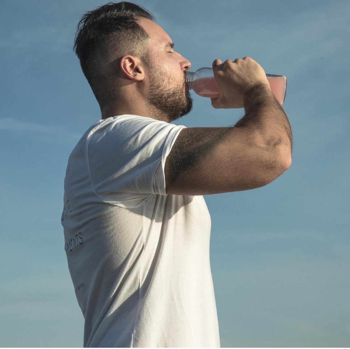 Man drinking Unity Clear ISO-Raspberry Lemonade