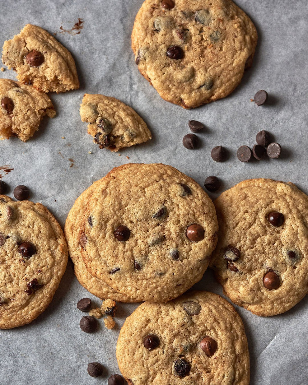 Close-up of chocolate chip protein cookies on parchment