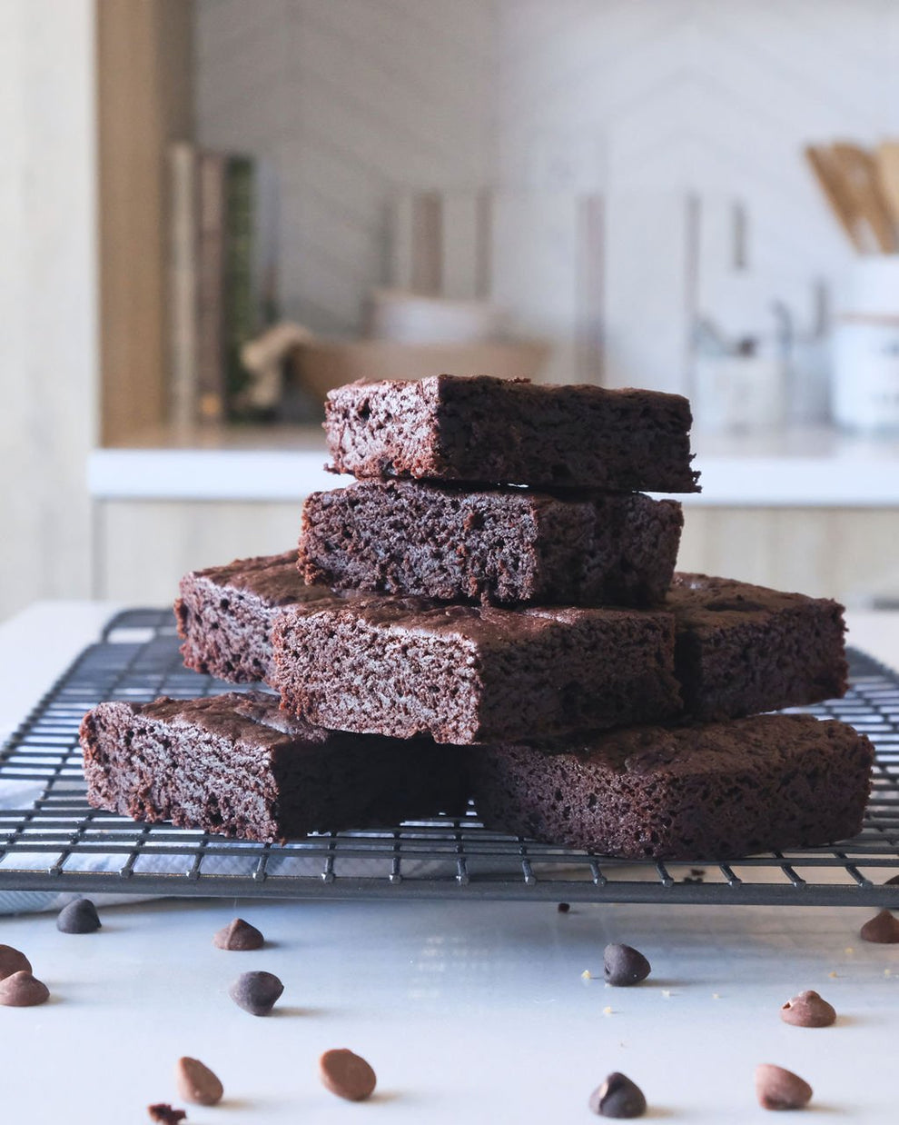 Stack of chocolate brownies on cooling rack