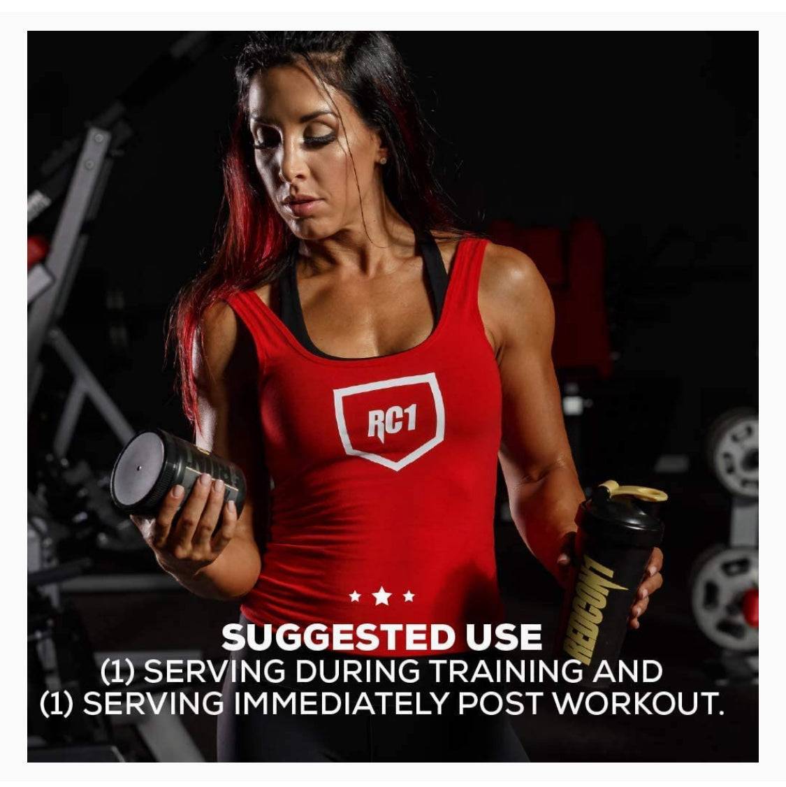 a woman in a red tank top holding a bottle of water